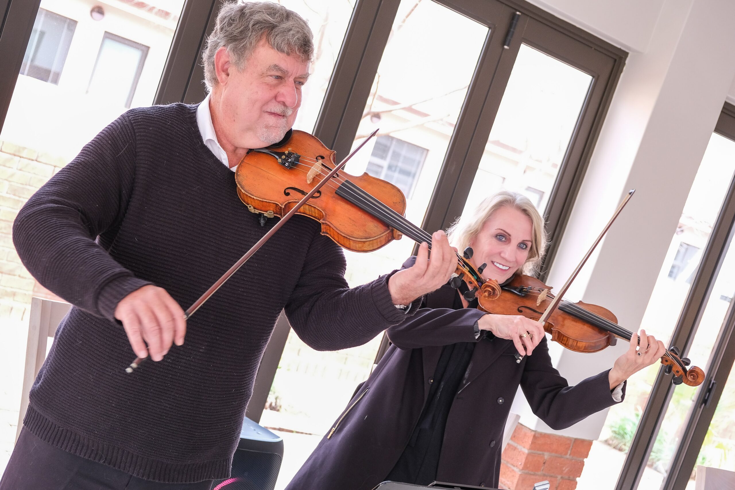 Elderly person playing the violin