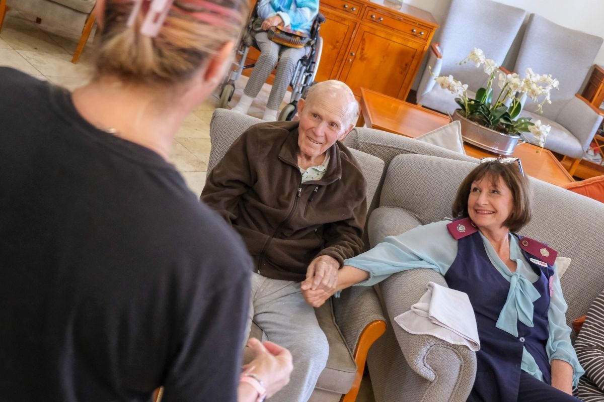 Older couple receiving warm personal support in a TOTALCARE Living community
