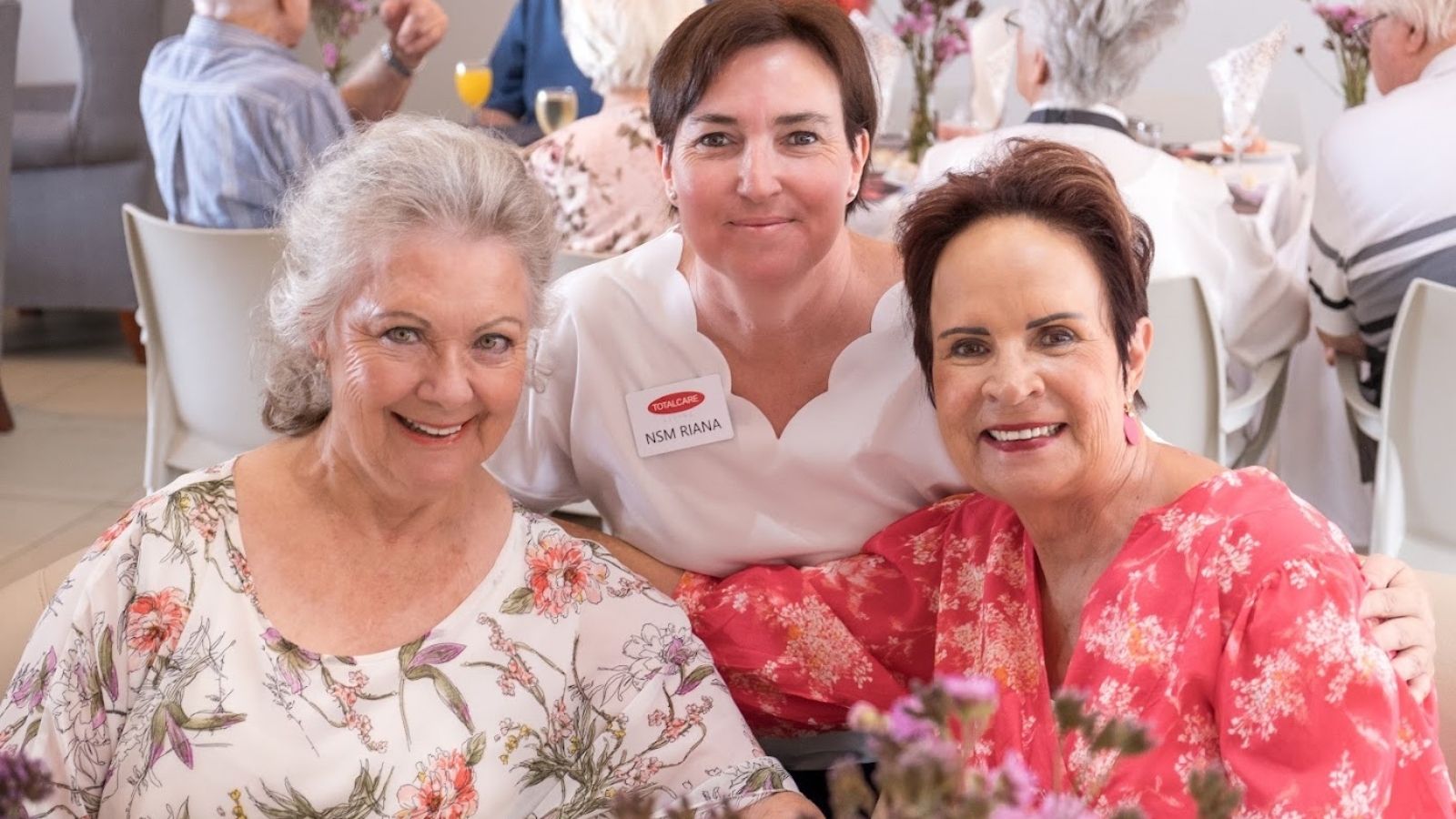Older adults enjoying social connection at TOTALCARE Living