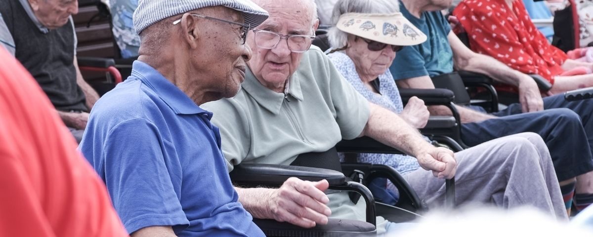 Two old men in wheelchairs at old age home